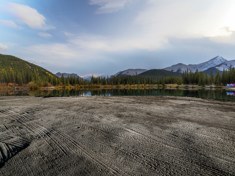 Sandy beach with tyre tracks by Forget-Me-Not Pond,Alberta,Canada.