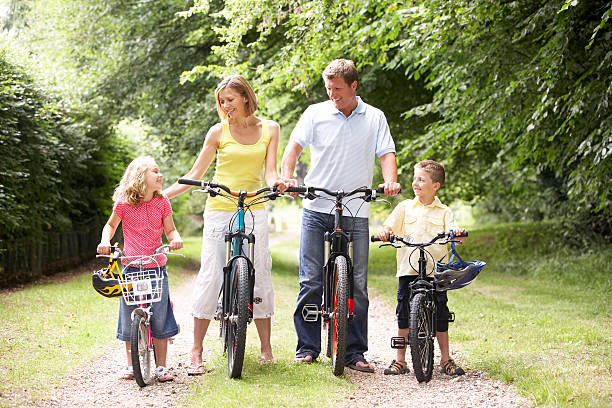 istock Family riding bikes in countryside 118452530
