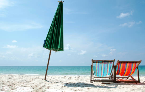 istock chairs and umbrella on the beach 1184528749