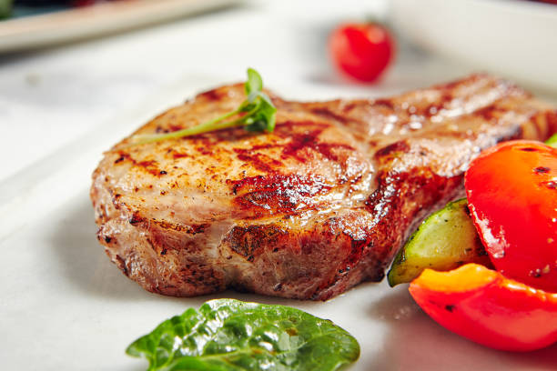 istock Grill Pork Chops with Vegetables 1184529965