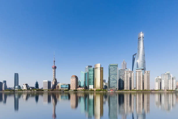 istock shanghai skyline and reflection against a sunny sky 1184530065