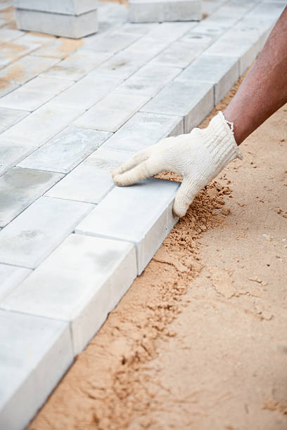 istock Installation of brick platform - laying bricks on sand 118454003