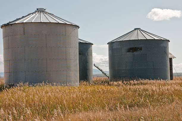 istock Steel Silos in a Field 118454004