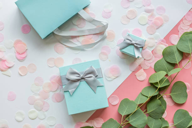 istock Gift or present box and confetti on pink table top view. Flat lay composition for birthday, mother day, 8 march, xmas, christmas, new year, valentine day or wedding. Holiday concept 1184540683