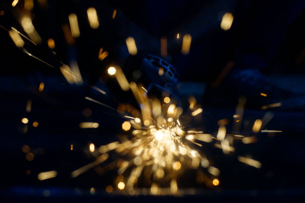 istock Bright blue and yellow sparks on a black background. Magical lig 1184541863