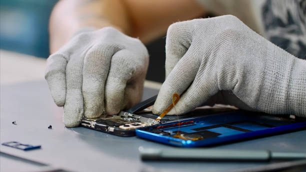 istock Heating chipset using soldering blow dryer for repair breakdowns in workshop. 1184545541