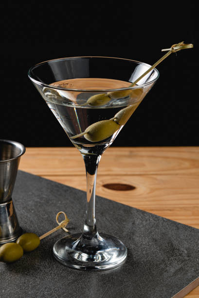 istock Drink Dry Martini with Green Olives on Stone Background 1184546735