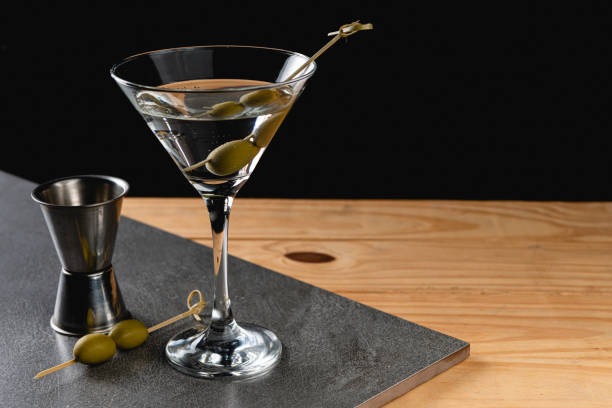 istock Drink Dry Martini with Green Olives on Stone Background 1184546782