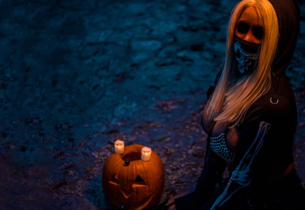 istock Girl with pumpkin 1184553530