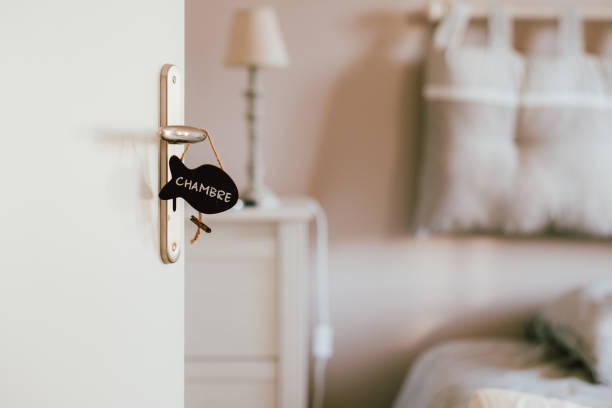 istock Open bedroom door with label sign on the handle 1184557879