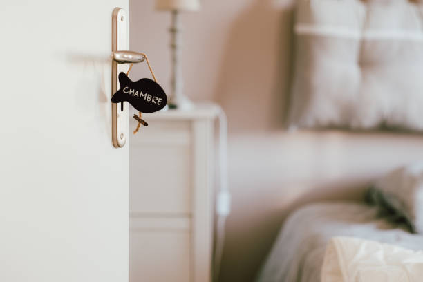 istock Open bedroom door with label sign on the handle 1184557907