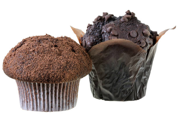 istock Two dark muffin decorated with chocolate chip Isolated 1184559201
