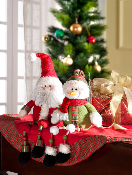 istock santa claus and snowman 1184560493