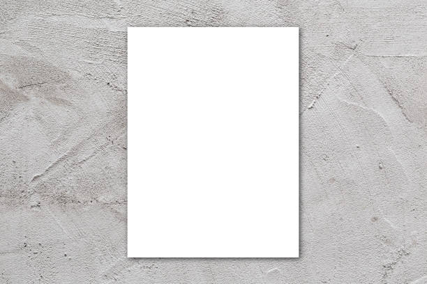 istock Blank paper labels on cement wall background, White poster on concrete wall background. 1184561479