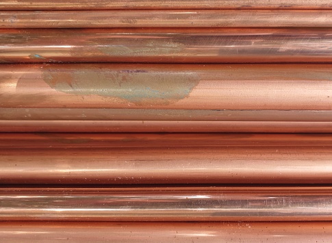 Copper pipe background.Long pieces of material were laid horizontally.