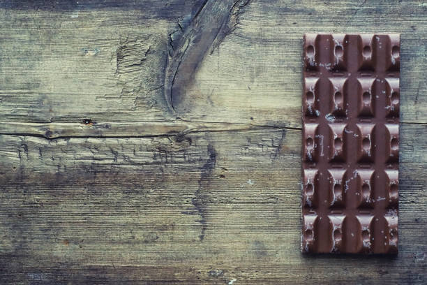 istock A bar of milk chocolate on the table. Chocolate with nuts and cinnamon. 1184563736