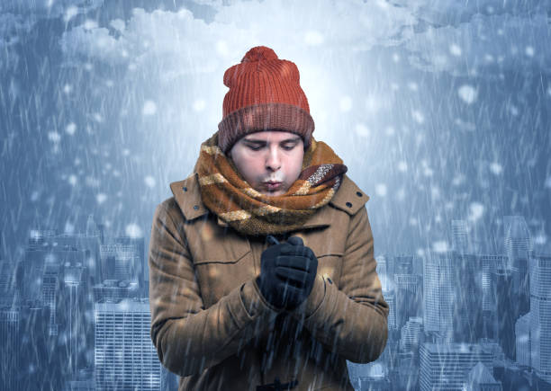 istock Boy freezing in cold weather with city concept 1184564004