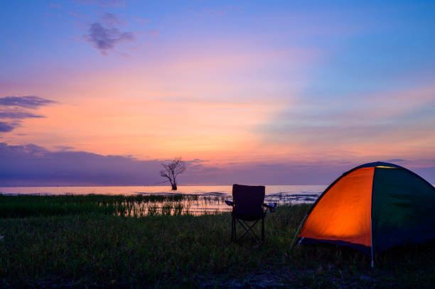 istock Tent and chairs by the lake 1184565333