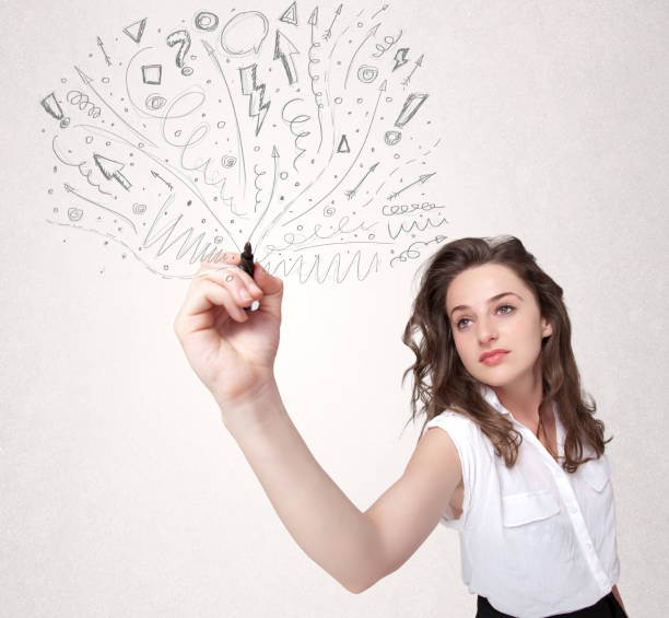 istock Young girl drawing and skteching abstract lines 1184565931