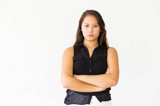istock Frowning dissatisfied female customer looking at camera 1184565982