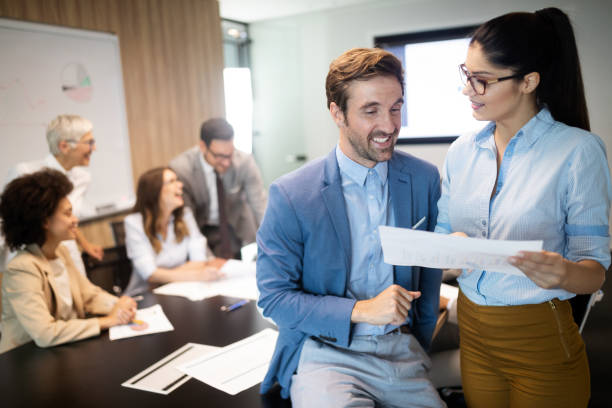 istock Group of successful business people at work in office 1184566118