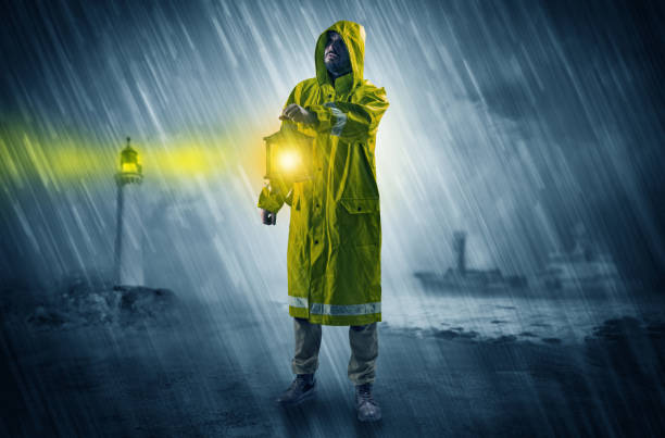 istock Man coming with lantern at coast concept 1184574516