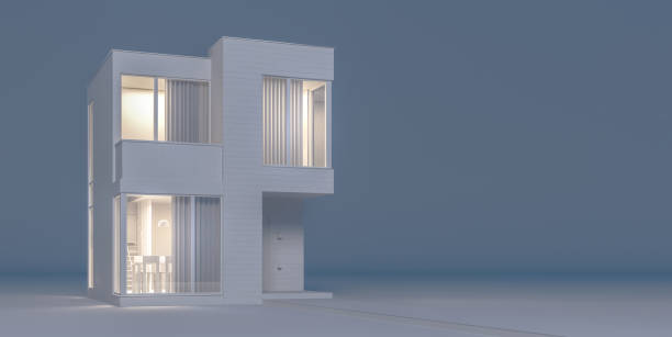 istock Modern house view from the outside in white materials imitating the layout with night lighting and light from the windows.3D illustration 1184576813