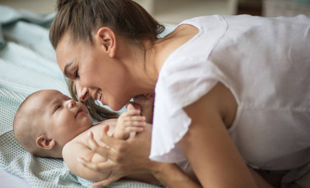 istock Mommy's little angel. 1184580515