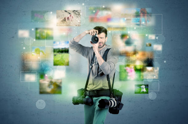 istock Photographer with pictures from the past 1184580604