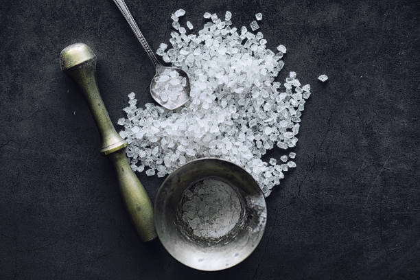 istock Large sea salt. Spice. Mortar and pestle for grinding. 1184580745