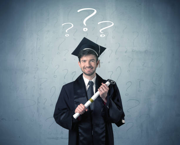 istock Young graduate teenager with question marks drawn 1184581423