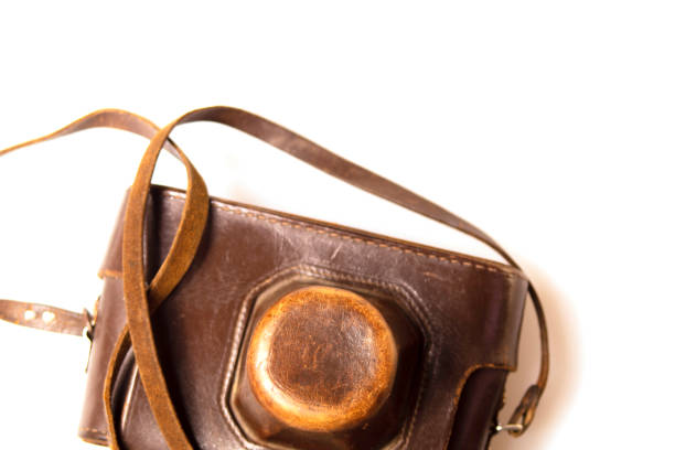 istock Vintage camera in old brown leather case 1184582763