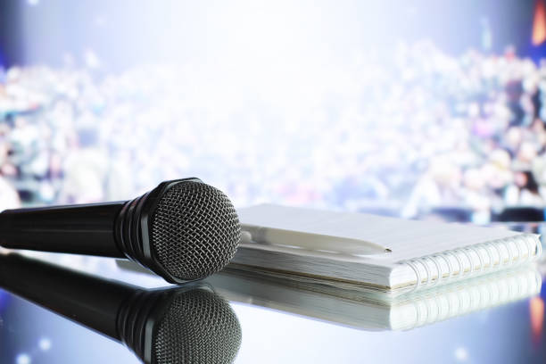 istock The microphone on the stage in front of the hall. Performance on stage. 1184583446