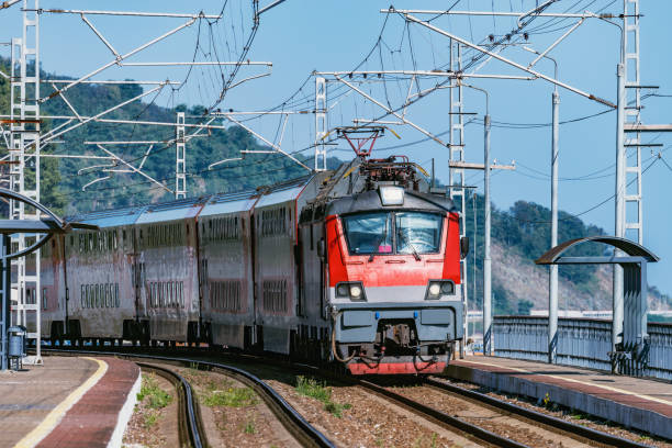 istock Passenger double deck train moves along the platform by the Black sea coast. 1184585058