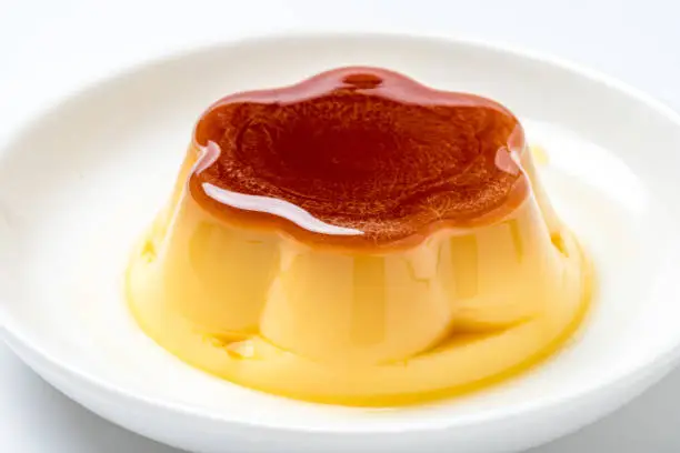 Pudding on plate on white background