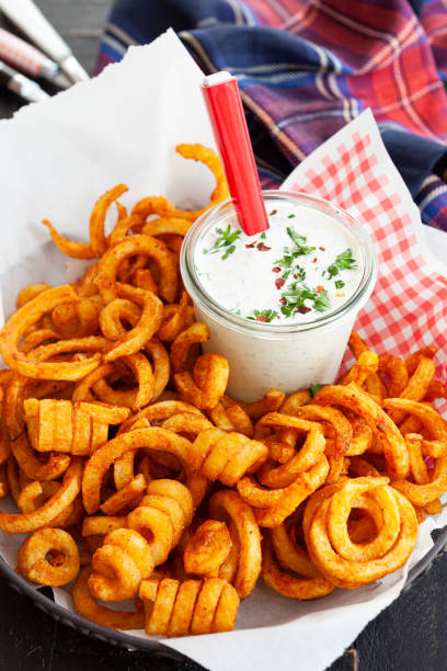 Basket full of curly fries stock photo
