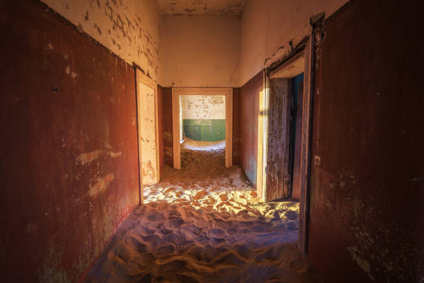 istock Empty corridor with sand on the ground in the Kolmanskop ghost town, Namibia 1184592098