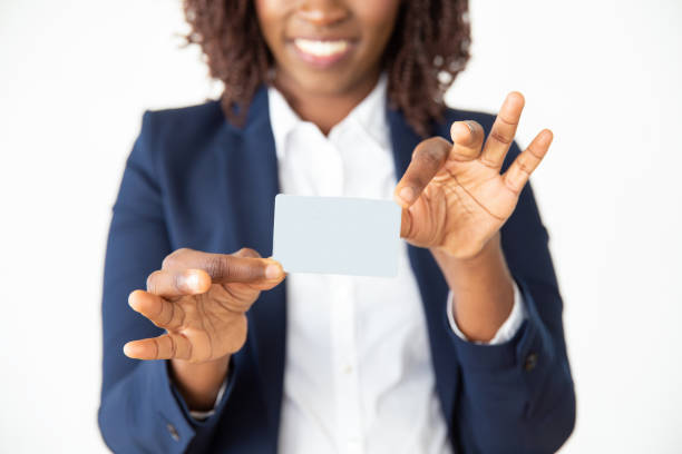 istock Smiling female professional holding blank plastic card 1184593941