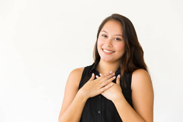 istock Content woman with hands on chest 1184595610