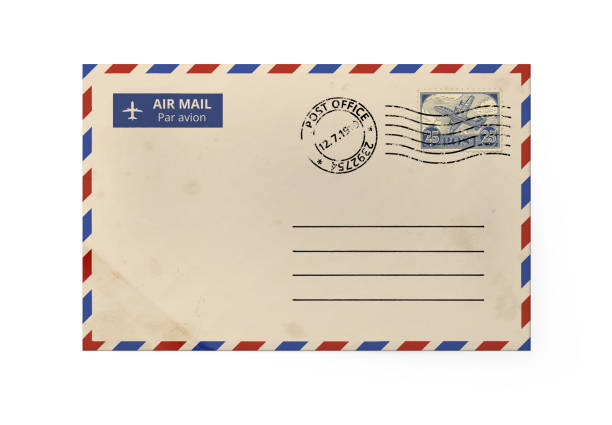 istock Old yellow paper envelope for letter - American Air Mail style with blue and red border stamped. Front side of envelope. 1184595633