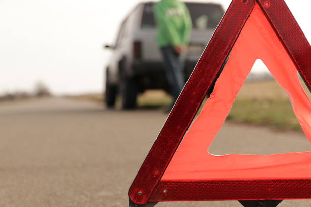 istock Red triangle of a stopped car on the road. 1184595728
