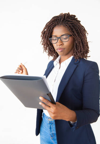 istock Focused legal expert reviewing contract 1184597214