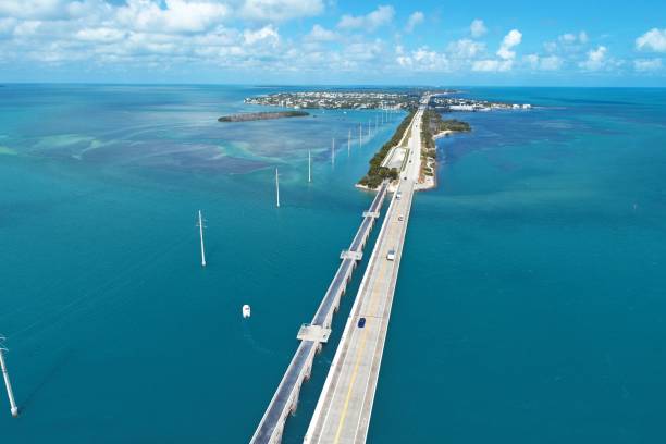 Aerial view of famous bridge and islands in the way to Key West, Florida Keys, United States. Great landscape. Vacation travel. Travel destination. Tropical scenery. Aerial view of famous bridge and islands in the way to Key West, Florida Keys, United States. Great landscape. Vacation travel. Travel destination. Tropical scenery. key largo stock pictures, royalty-free photos & images