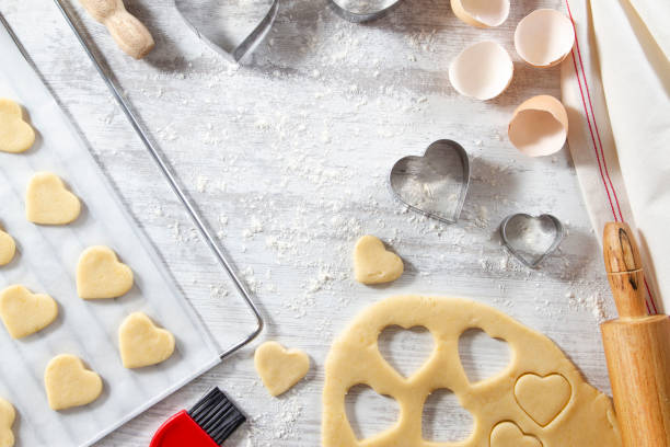 istock Making of Heart Shaped Cookies on White Kitchen Table 1184599053