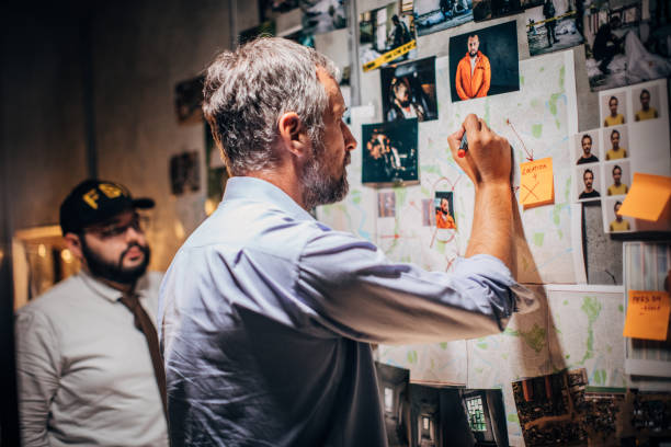 istock Men FBI agents looking for clues together 1184599104