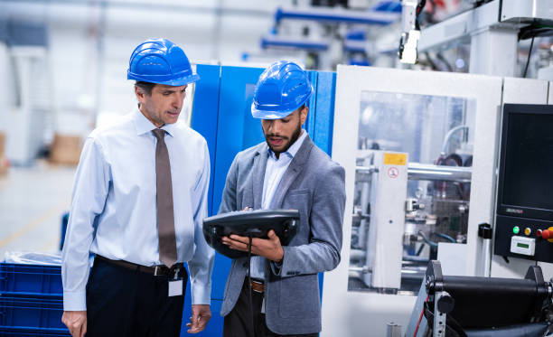 istock Manager Talking To African-American Engineer 1184600924