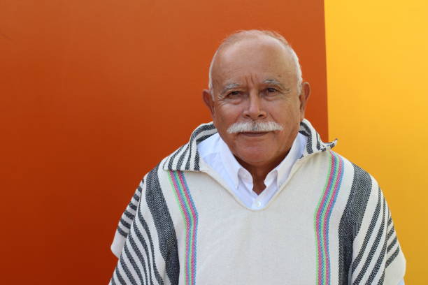 Tender looking old man wearing a poncho