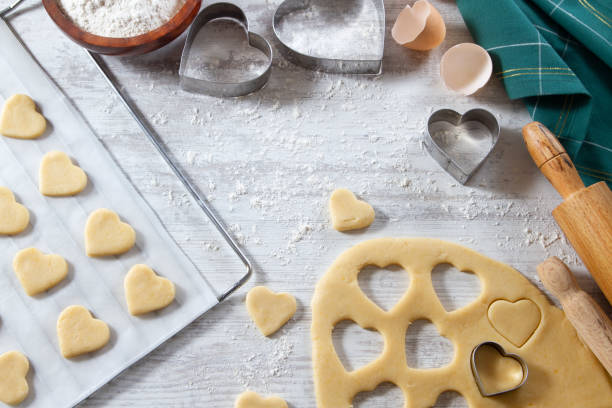 istock Making of Heart Shaped Cookies on White Kitchen Table 1184602444