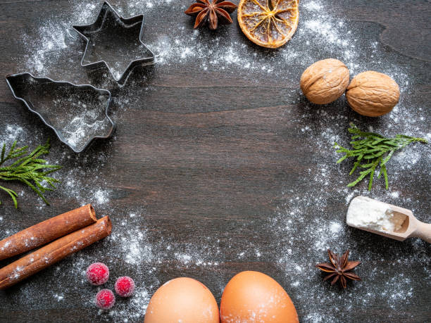 istock Baking ingredients for Christmas biscuits on a brown wooden table 1184603592