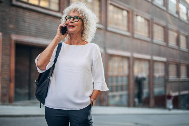 istock Lady talking on mobile on the street 1184603924
